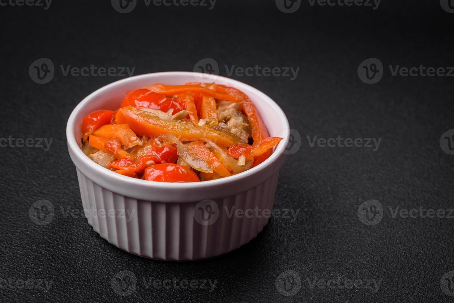 Delicious fresh stew with chicken or turkey with slices of sweet pepper and carrots photo