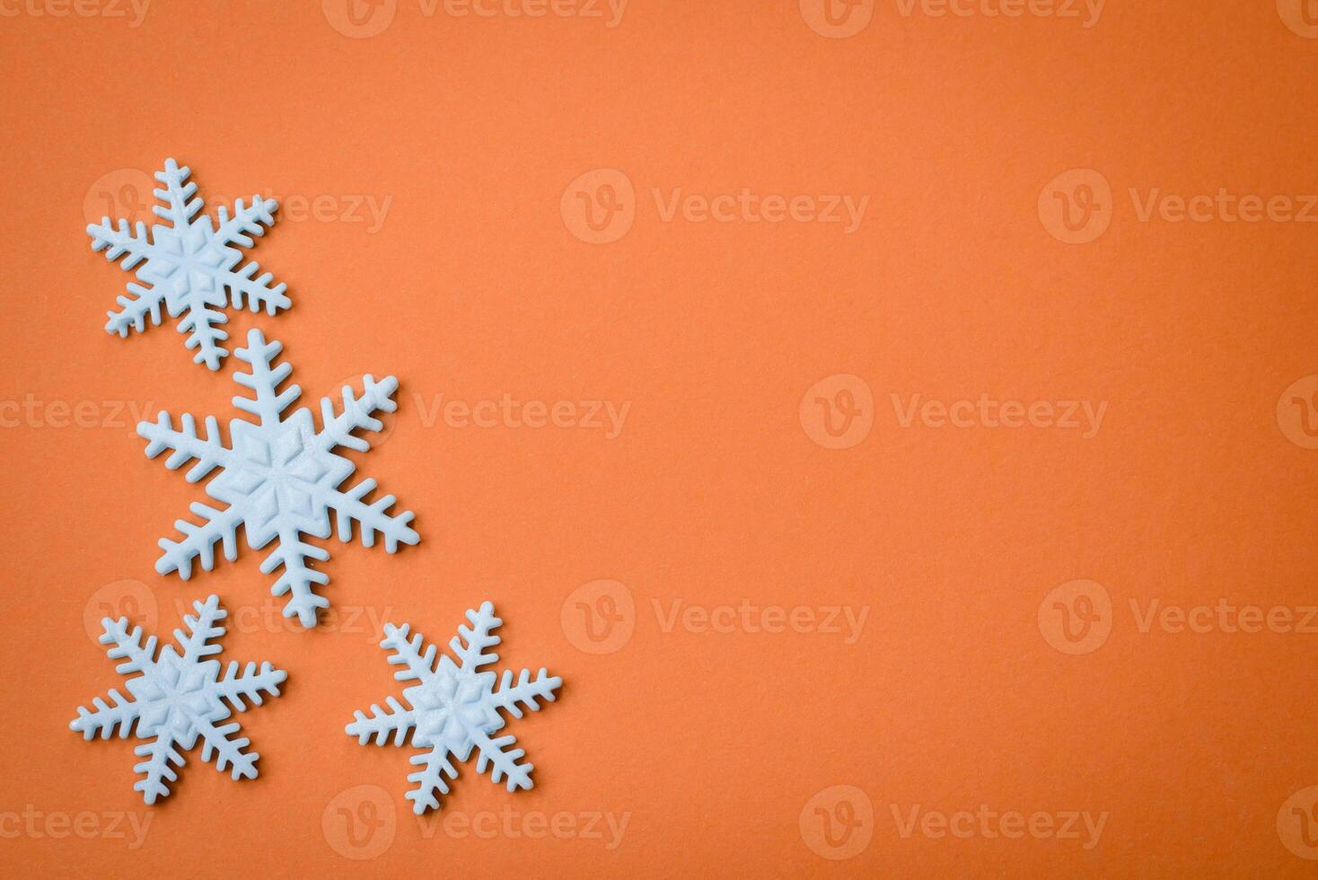Beautiful winter snowflakes on a plain background with copy space photo