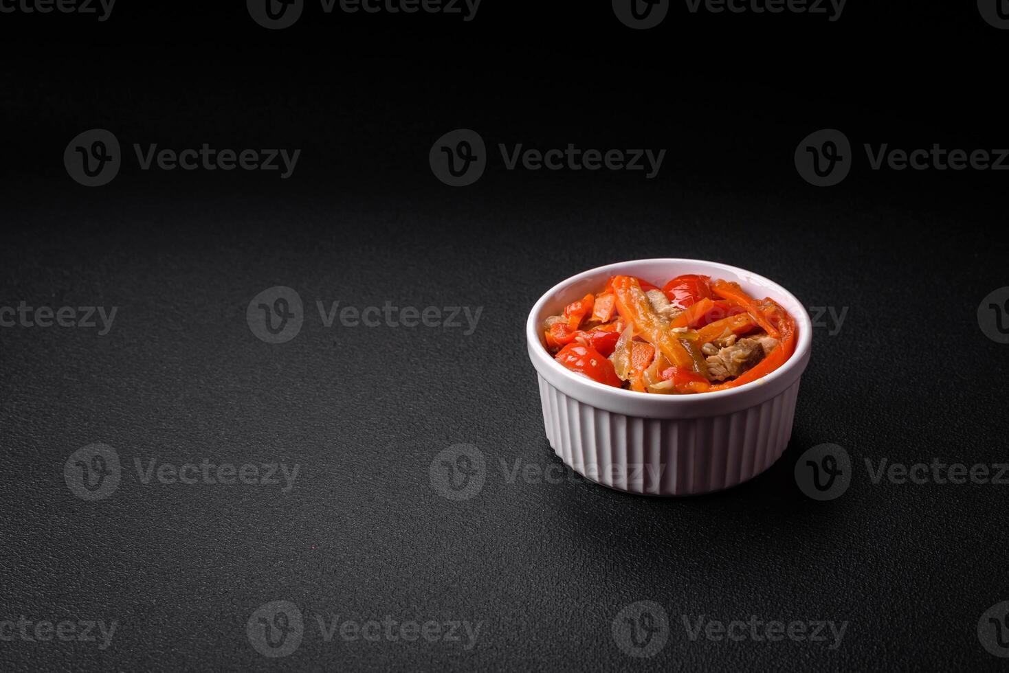 Delicious fresh stew with chicken or turkey with slices of sweet pepper and carrots photo