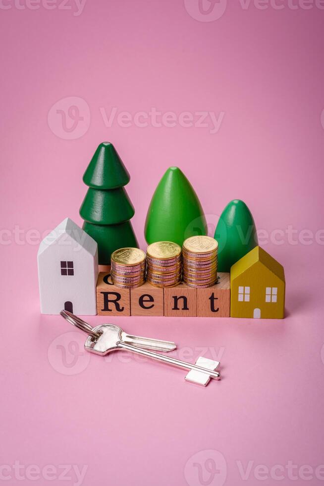 Small wooden house and the inscription for rent. Concept for sale, rental of real estate for a family photo