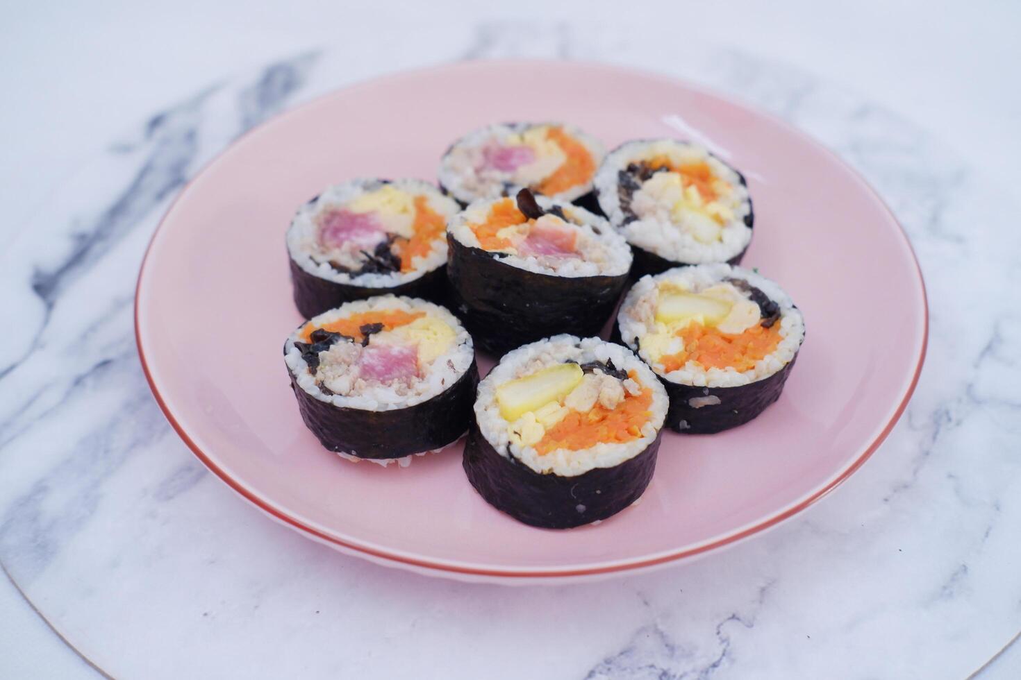 Sushi rolls on a plate on a white background. Japanese food photo