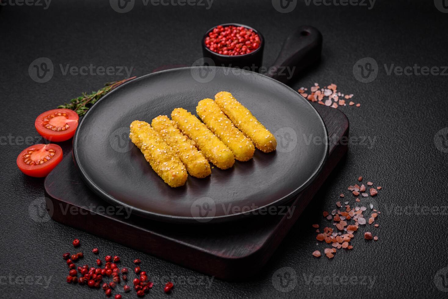 Delicious crispy cheese sticks with mozzarella, salt and spices, breaded and fried in oil photo