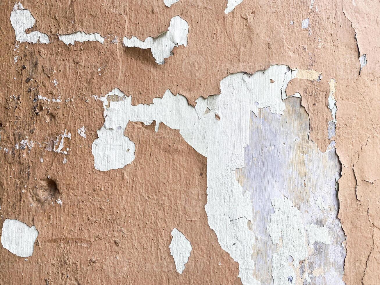 Dark concrete texture with a stucco finish on a white background. photo