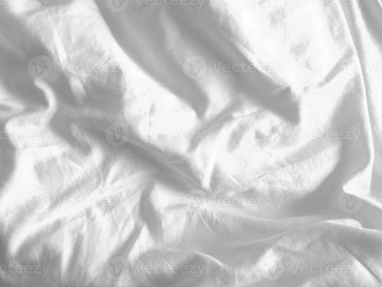 This handmade white fabric, with its subtle wrinkled pattern, adds a touch of uniqueness to any design, providing an empty canvas for creativity. photo