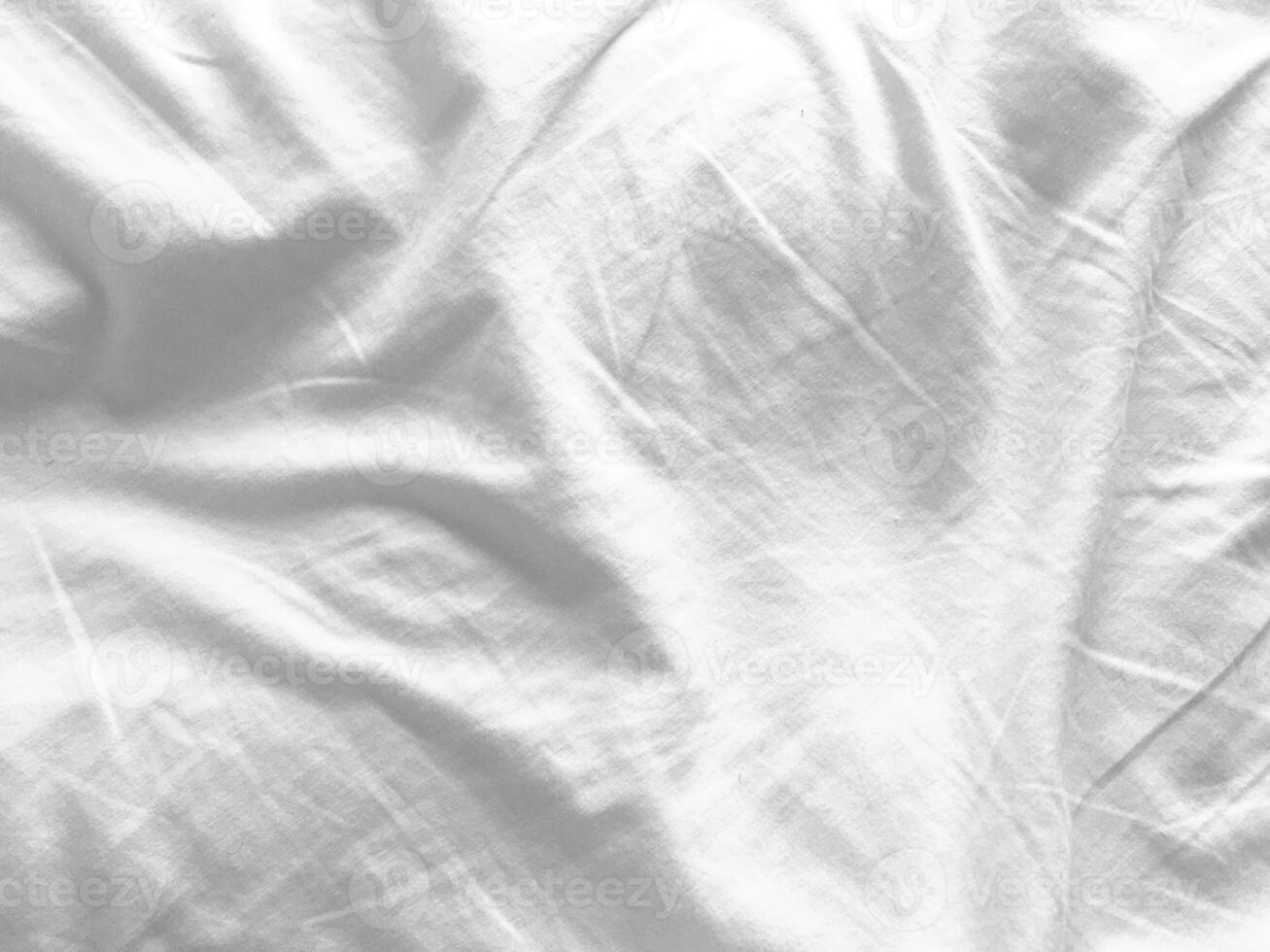 A beautiful, flowing textile with a satin finish, creating an elegant backdrop that seamlessly blends simplicity with a touch of opulence. photo