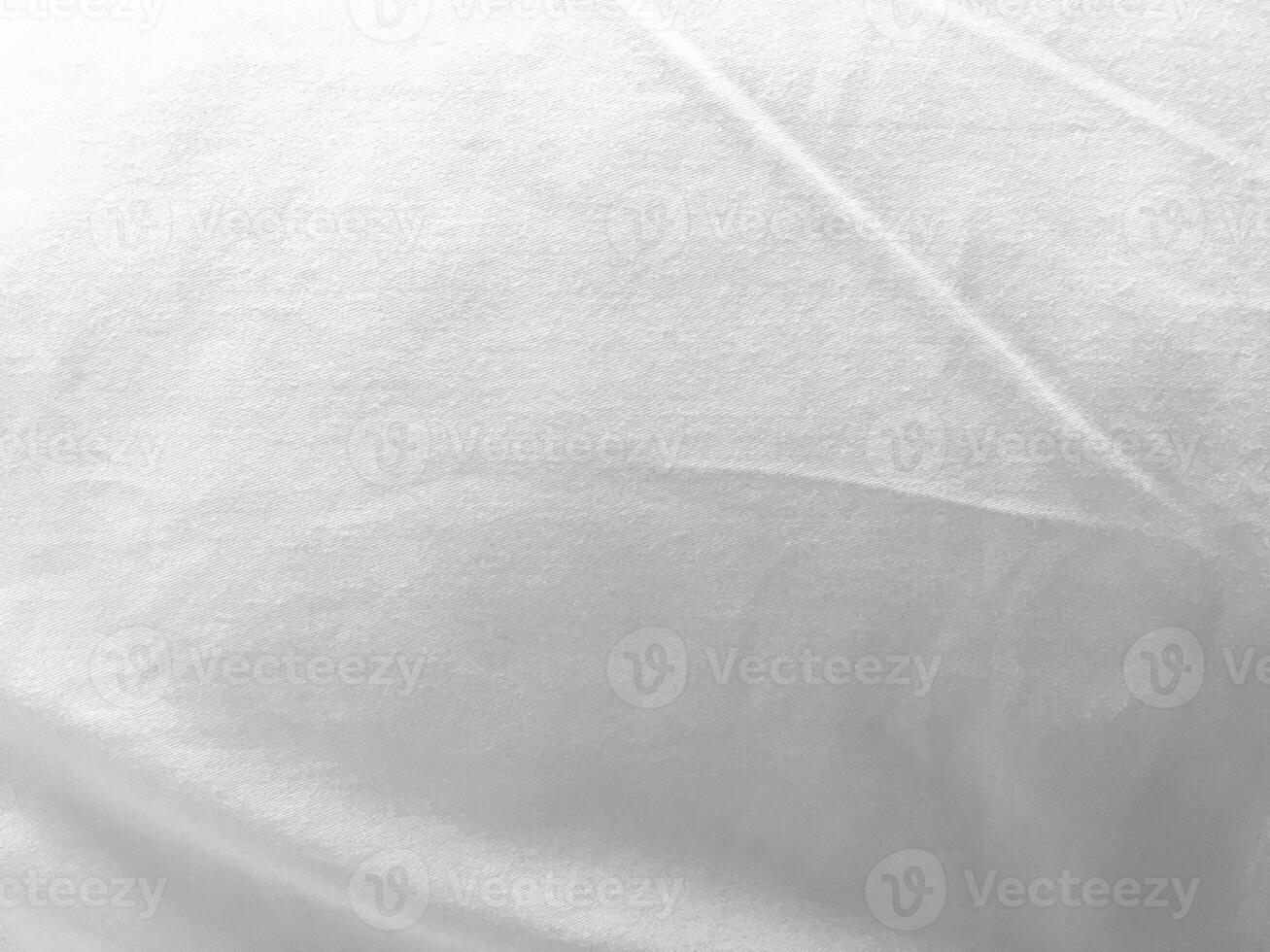 A minimalist yet captivating white textile background, featuring a silky and smooth fabric that radiates a sense of tranquility and sophistication. photo