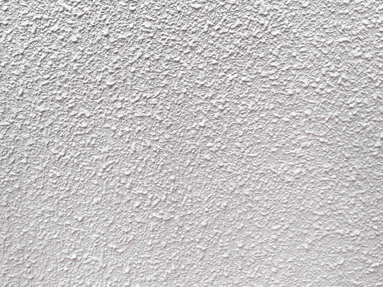 The abstract details on the cement wall make it a compelling design element. photo