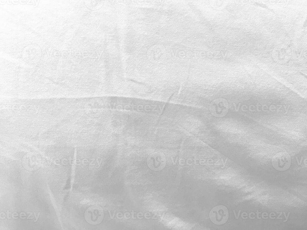 A minimalist yet captivating white textile background, featuring a silky and smooth fabric that radiates a sense of tranquility and sophistication. photo