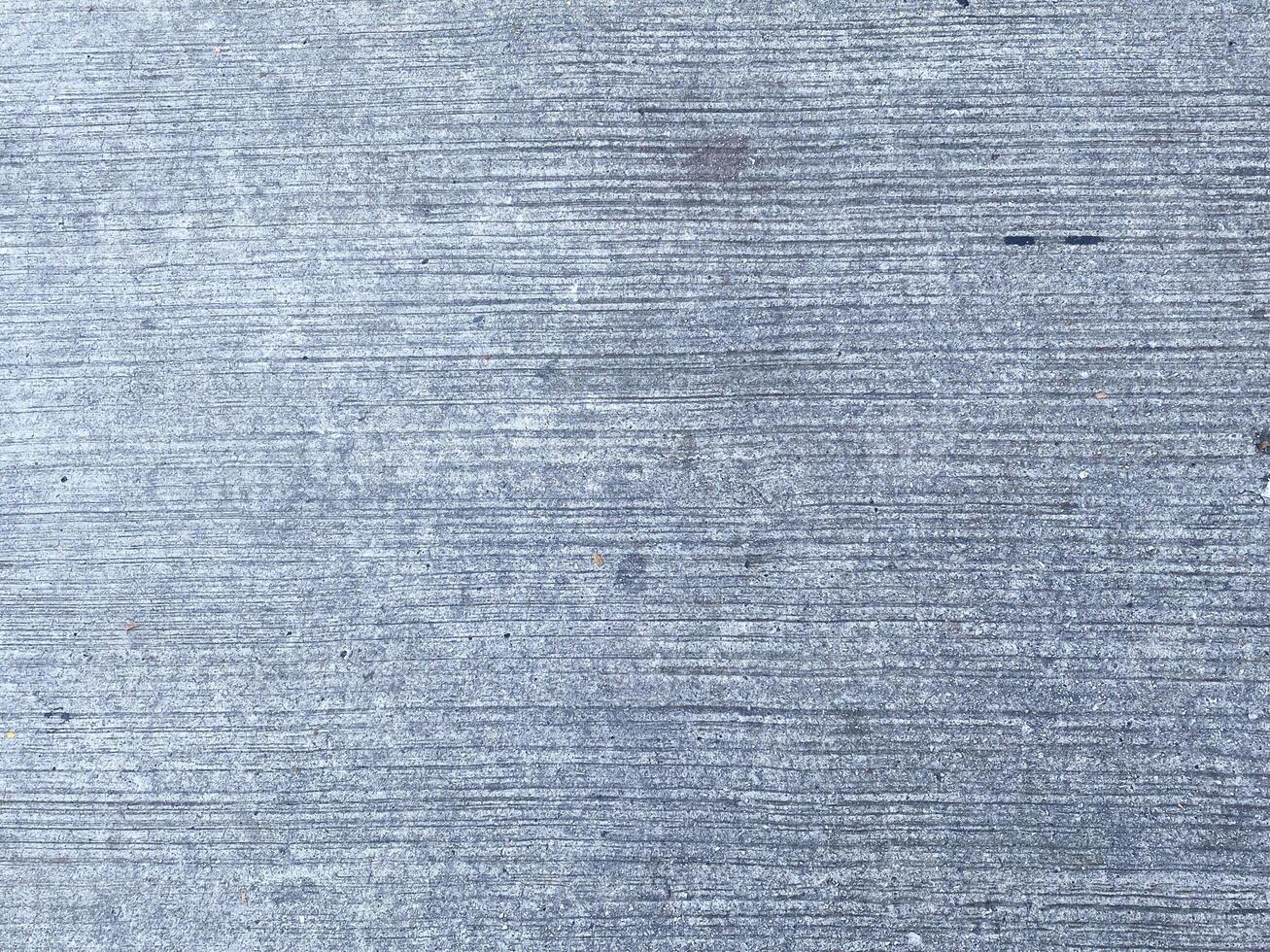A retro wallpaper featuring a dark and scratched concrete texture.  copy space for design photo