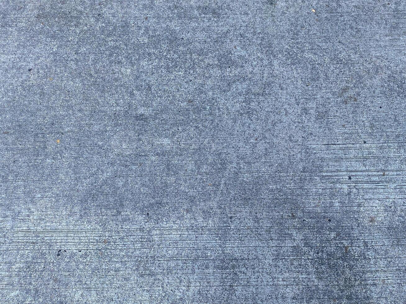 Grey and empty, this concrete background provides ample copy space for your design. photo