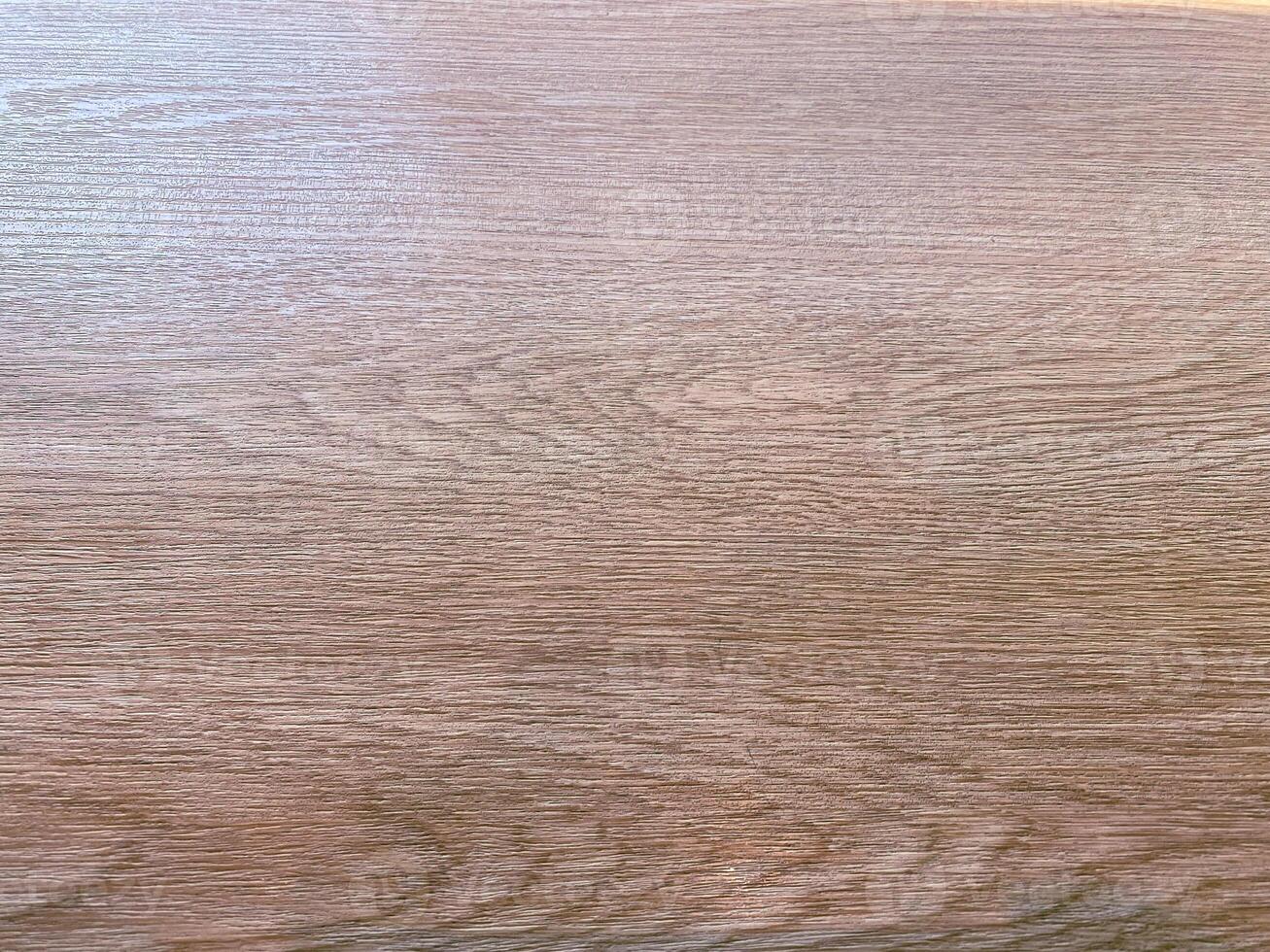 Teak wood with a rough and textured appearance, providing a raw and organic feel to designs. photo