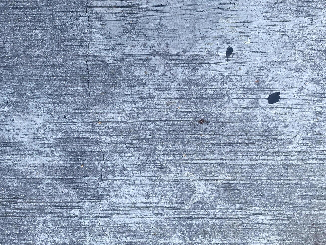 A retro wallpaper featuring a dark and scratched concrete texture.  copy space for design photo