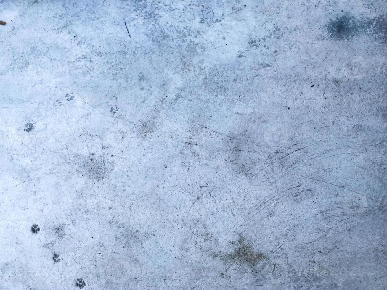 scratched concrete backdrop, giving your design a rustic and worn appearance photo