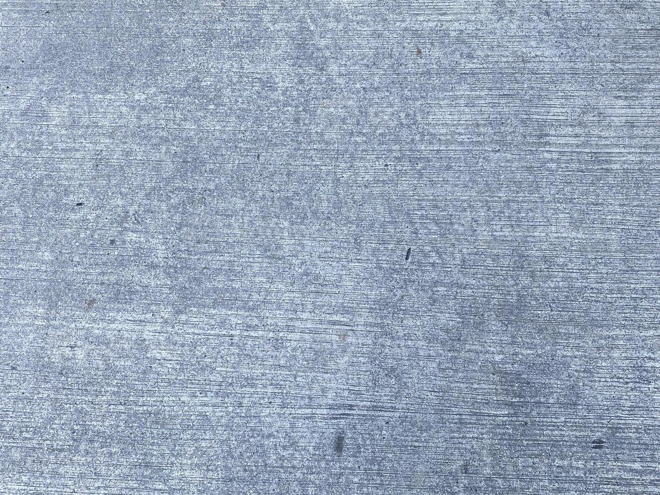 Grey and empty, this concrete background provides ample copy space for your design. photo