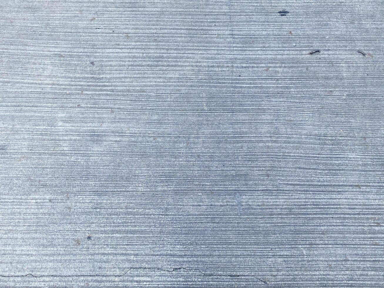 Grey and empty, this concrete background provides ample copy space for your design. photo