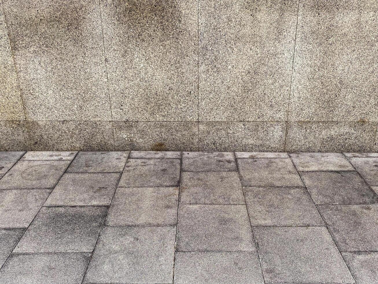 The abstract patterns on the rough wall create a visually interesting composition. photo