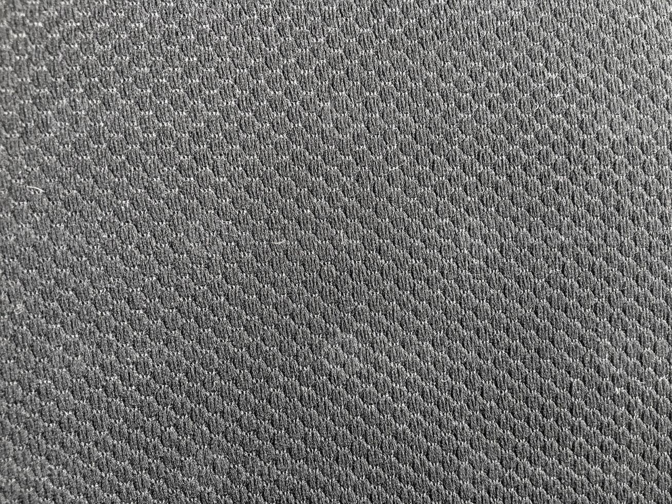 The black texture background provides a sleek and stylish backdrop, suitable for various design applications. photo