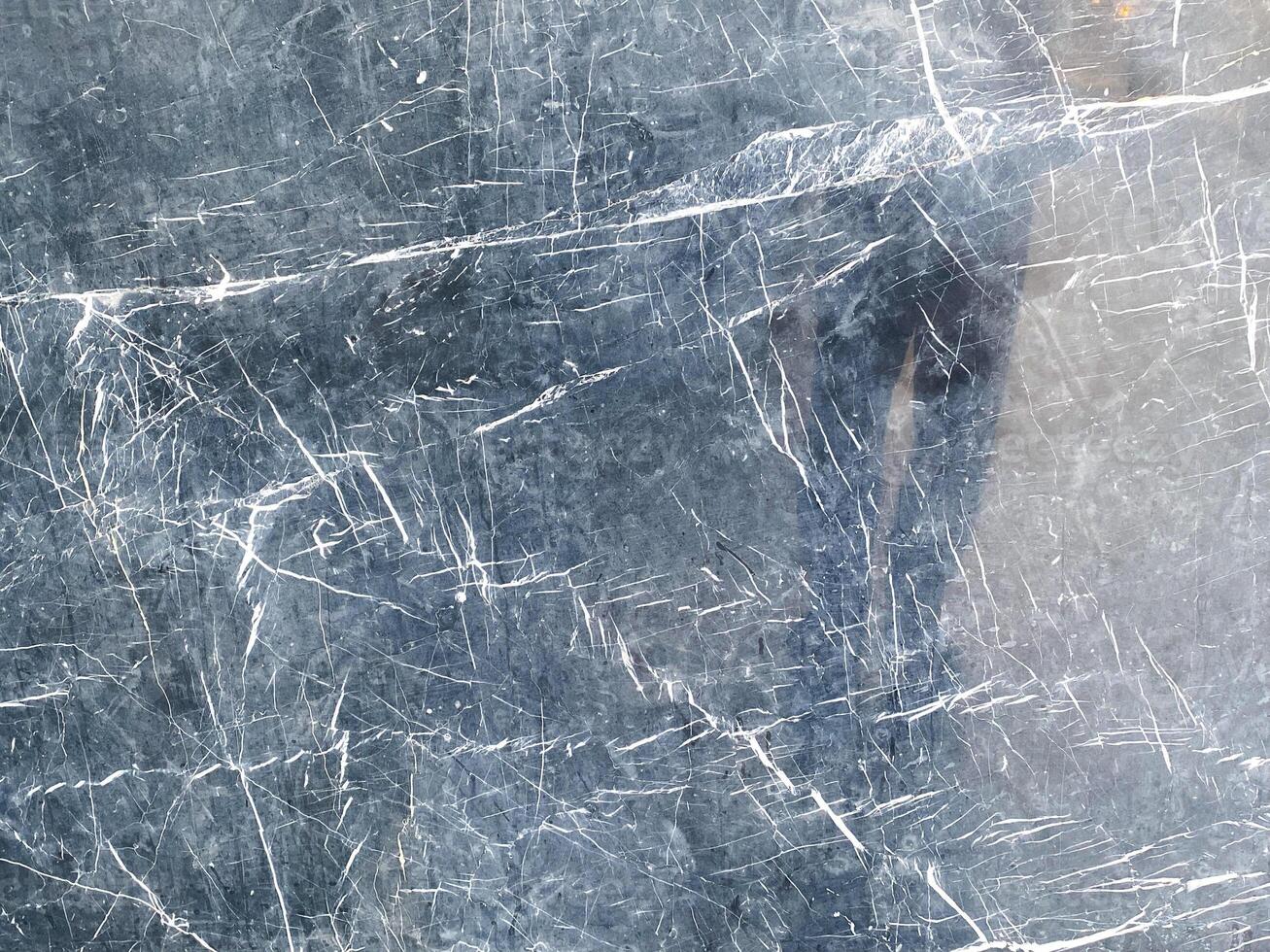 A dark and abstract concrete wall, adding depth and intrigue to your design. photo