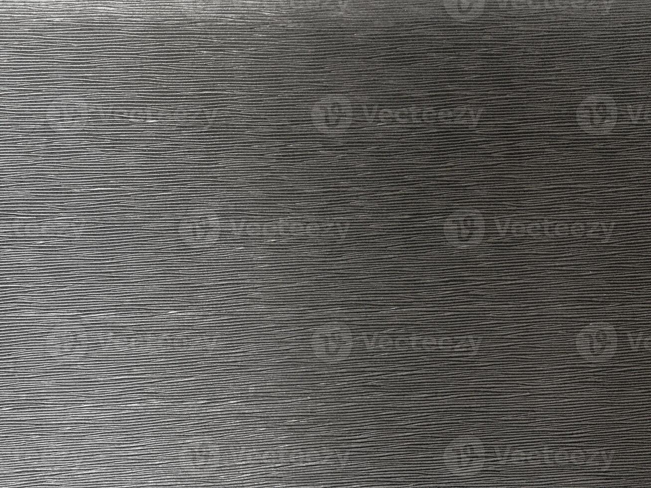 The surface of this black backdrop is intricately textured, creating a captivating abstract composition. photo