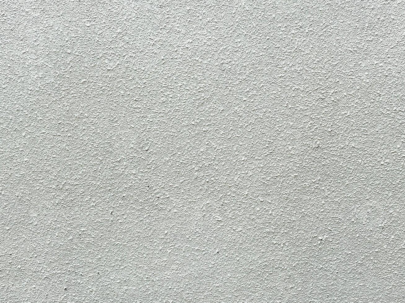 The abstract details on the cement wall make it a compelling design element. photo