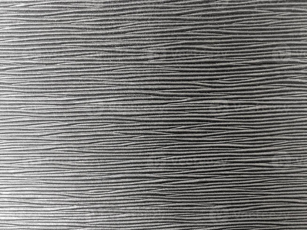 The dark space is filled with an exquisite pattern, making it an ideal wallpaper for a contemporary look. photo