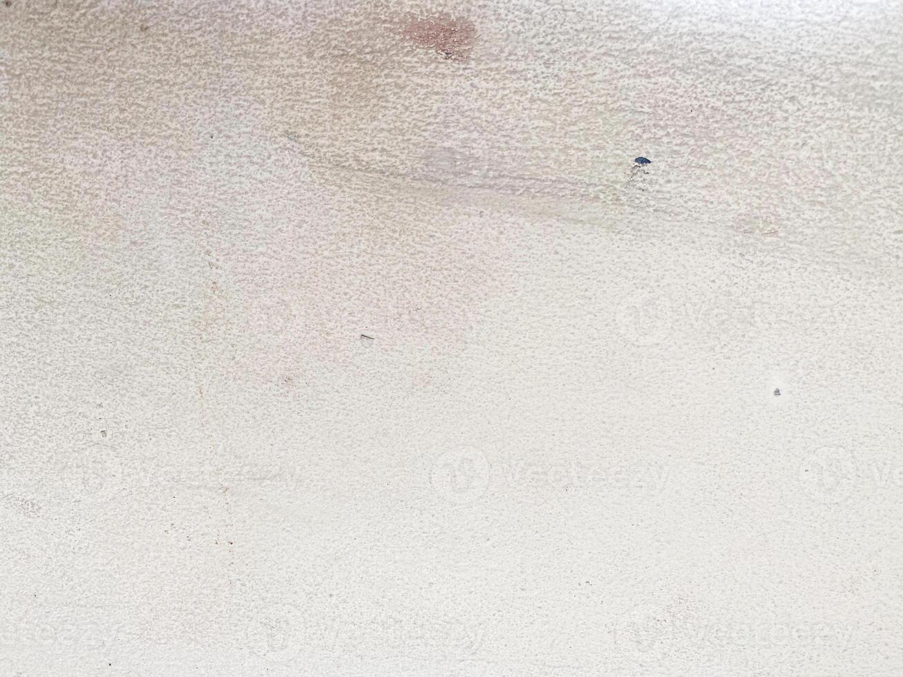 The rough surface of the concrete creates an interesting visual pattern. photo
