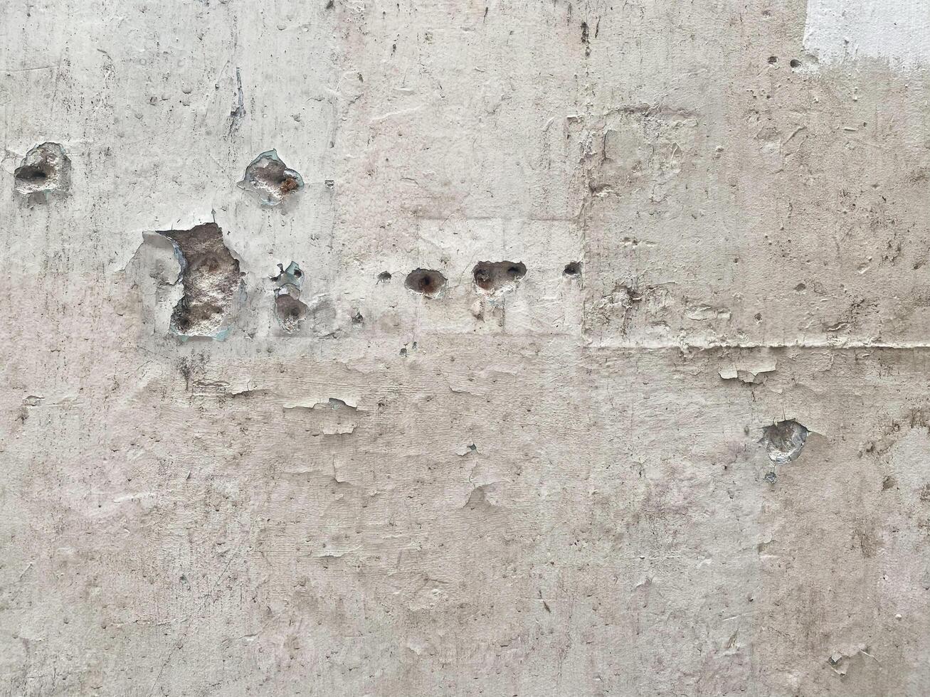 Dirty and ancient concrete wall with a crumpled paper effect. photo