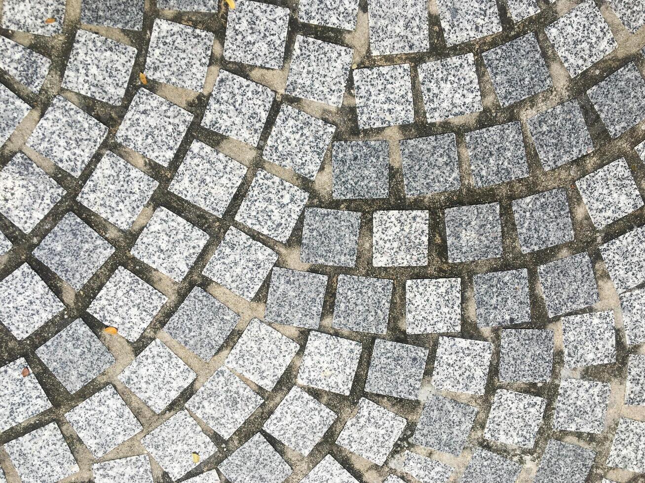 Rough and weathered concrete floor with a retro and vintage design. photo