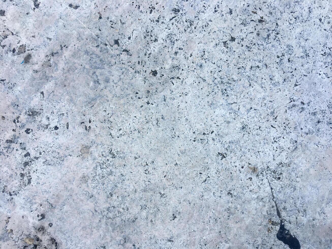 A bright and rough concrete backdrop on a white background. photo