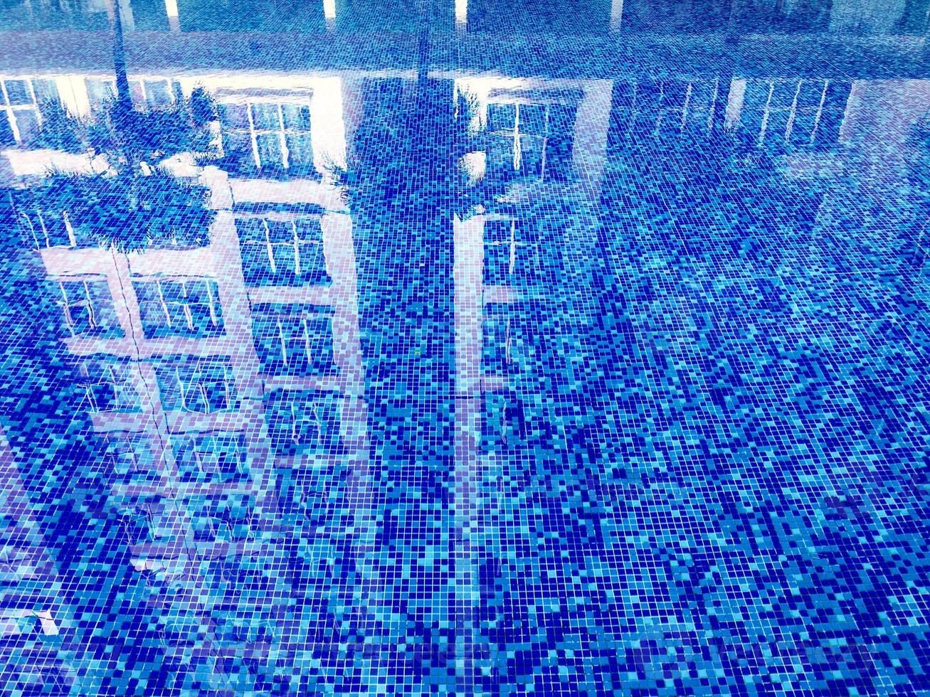 The abstract beauty of clean and clear water in a sparkling pool, creating a mesmerizing ripple pattern. photo