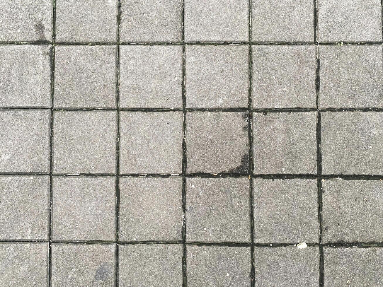 Dark and isolated concrete texture, offering a versatile and impactful design element. photo
