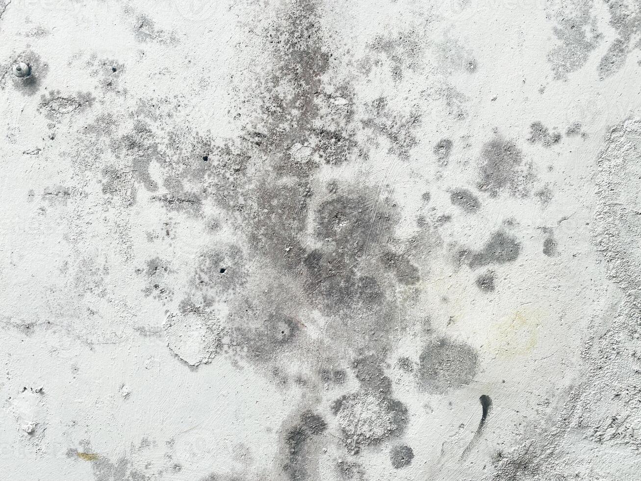 Scratched and messy concrete backdrop with space for design. photo