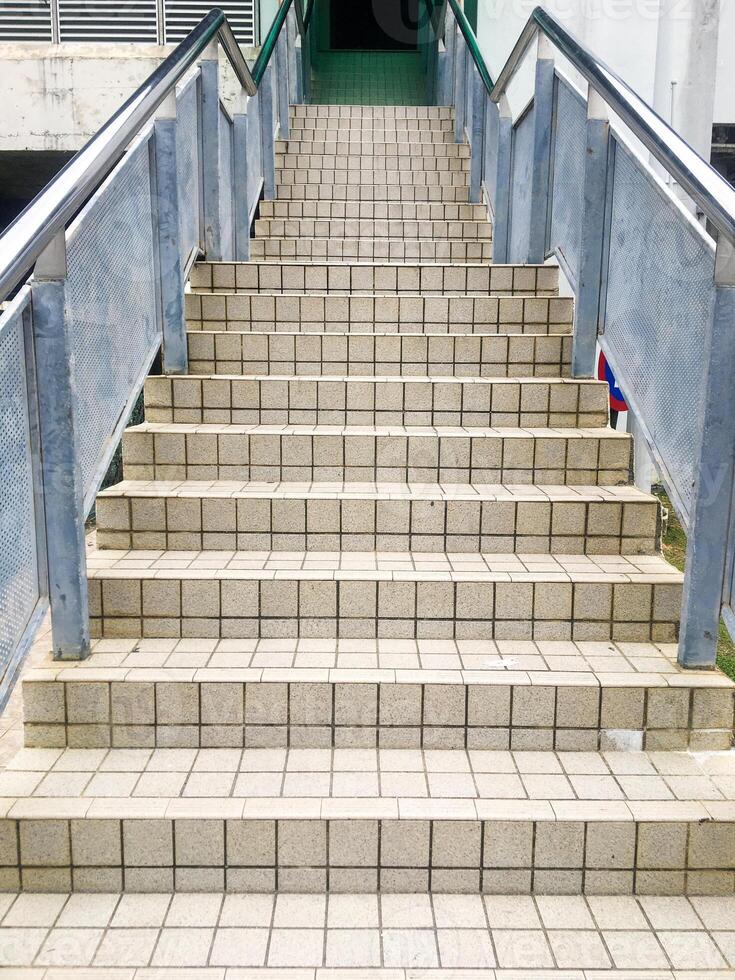 The metal structure of the railing adds an industrial touch to the overall construction of the building photo