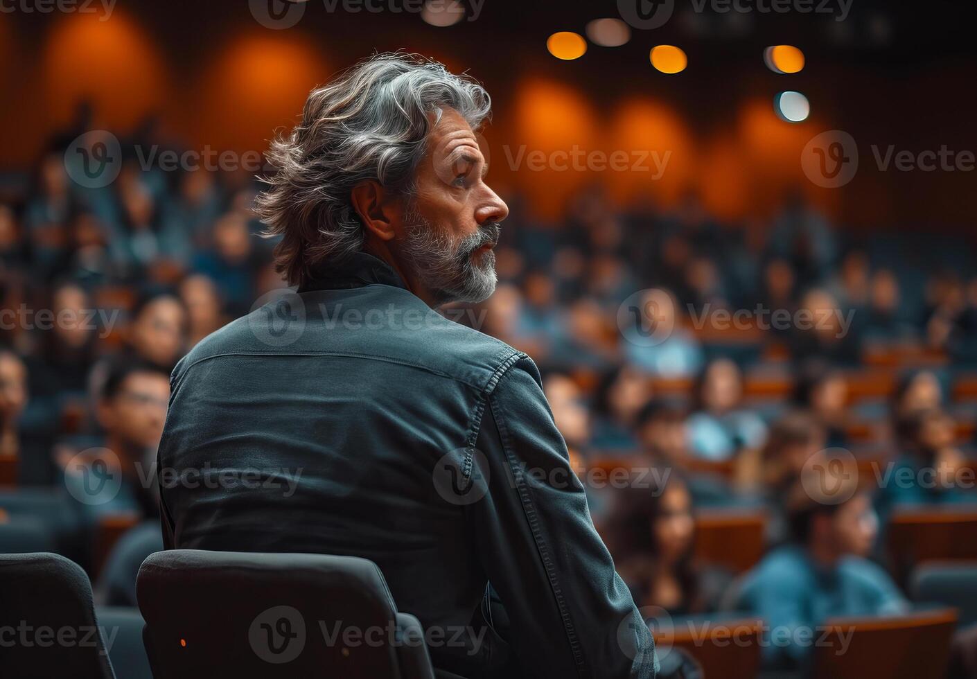 AI generated An employee is presenting to a room full of people. A man sitting in front of a crowd of people, delivering an engaging and captivating presentation. photo