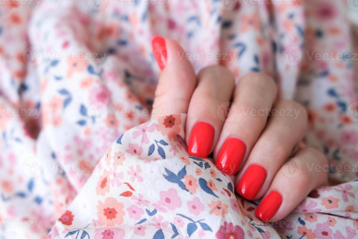 Beautiful female hands with red manicure. Summer manicure. Copy space. photo