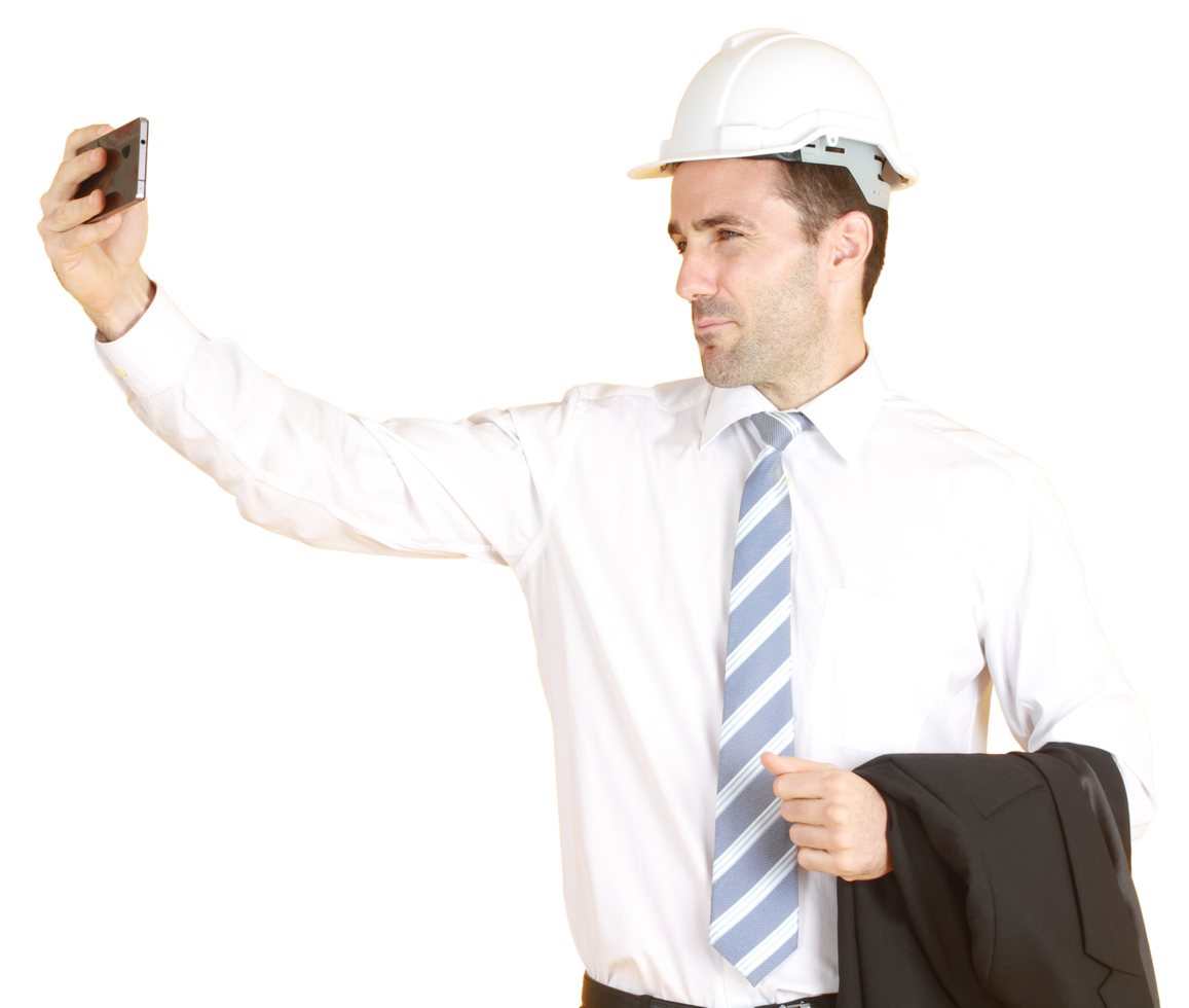 Handsome smart engineer or architecture is Wearing a white safety hat with hand holding smartphone and enjoy with Selfie by himself png