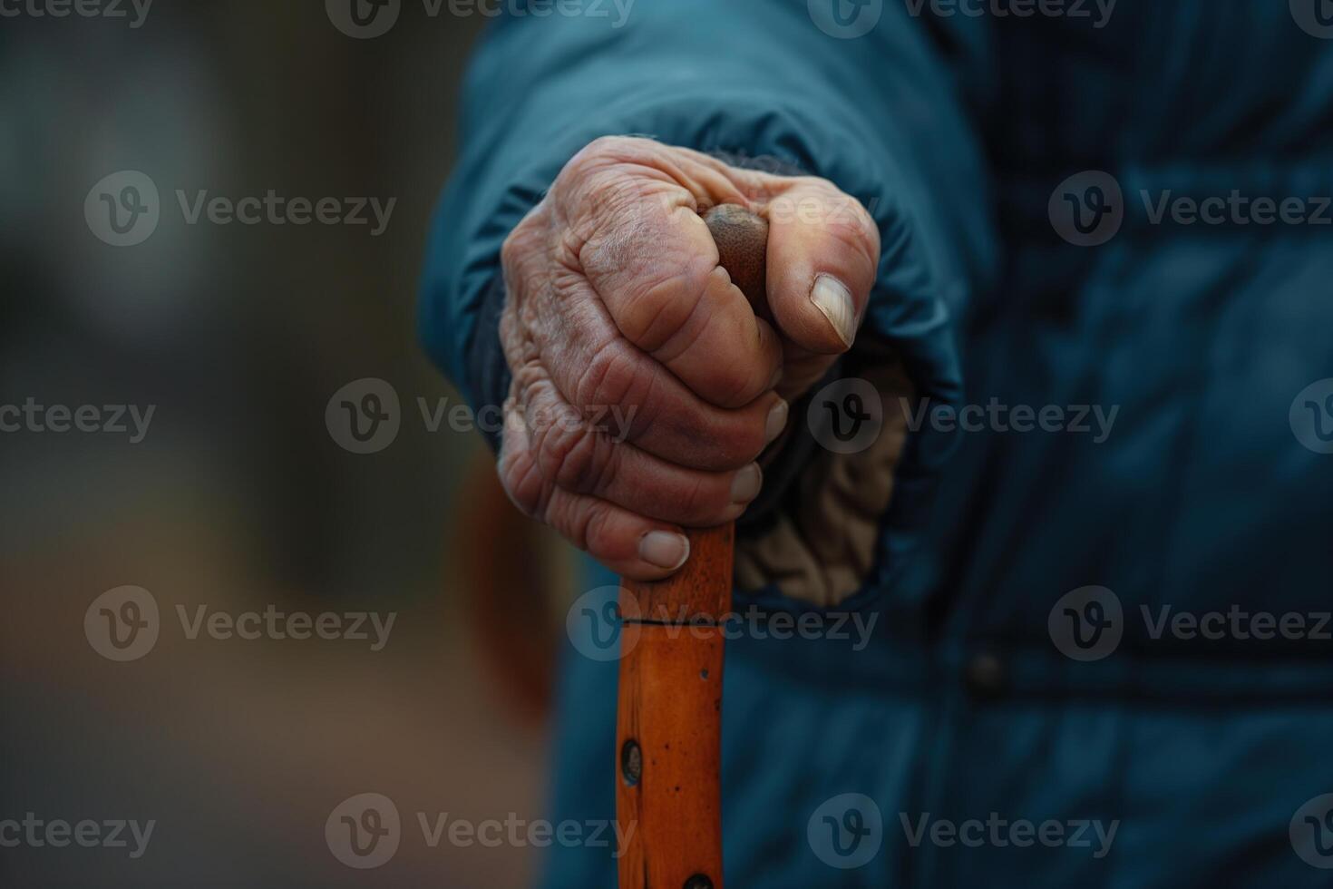 AI generated Close-up of an elderly person's hand clutching a wooden cane for support during a walk at sunset. photo