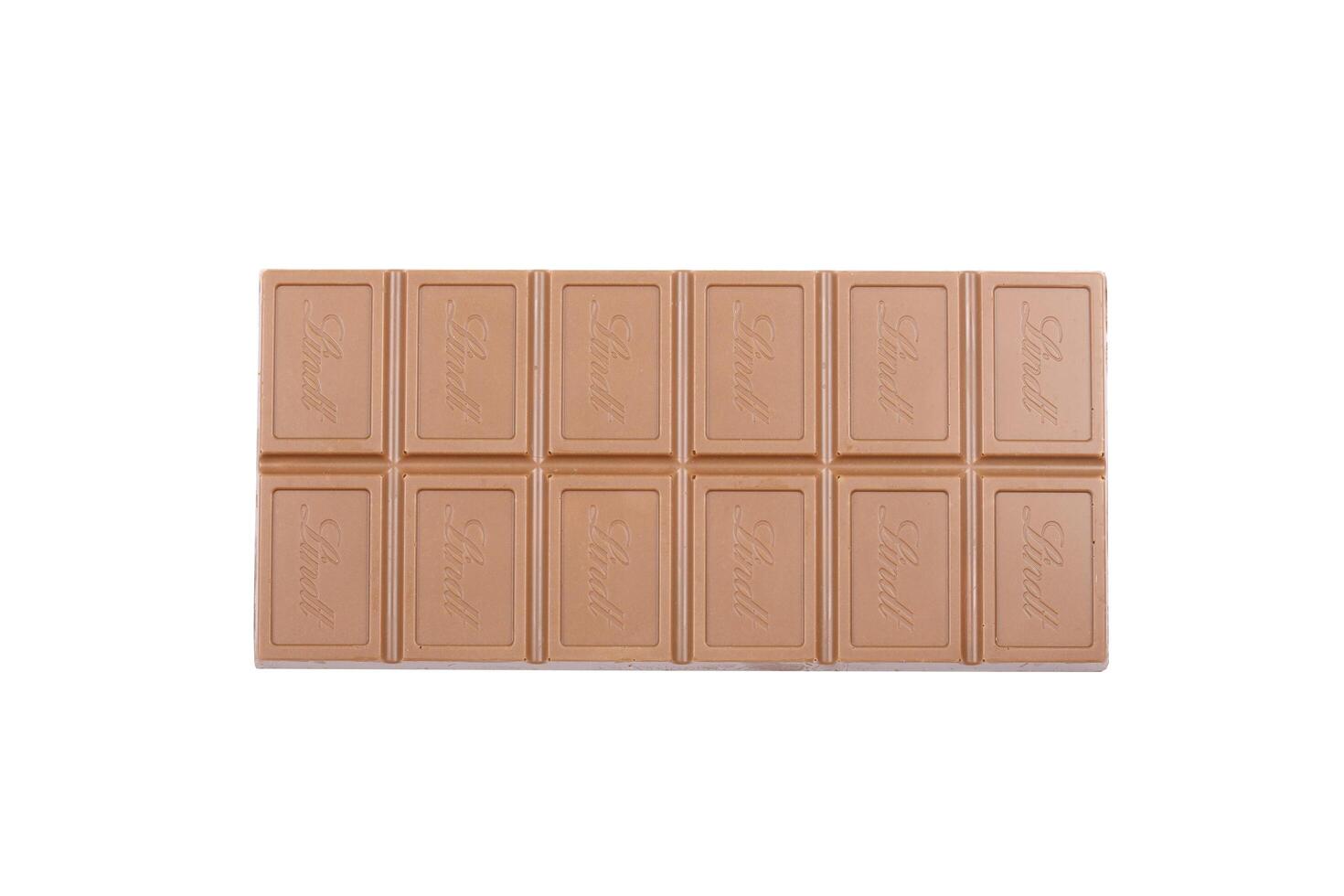 KYIV, UKRAINE - MAY 4, 2022 Lindt Swiss luxury brand chocolate brown tablets with embossed logo photo