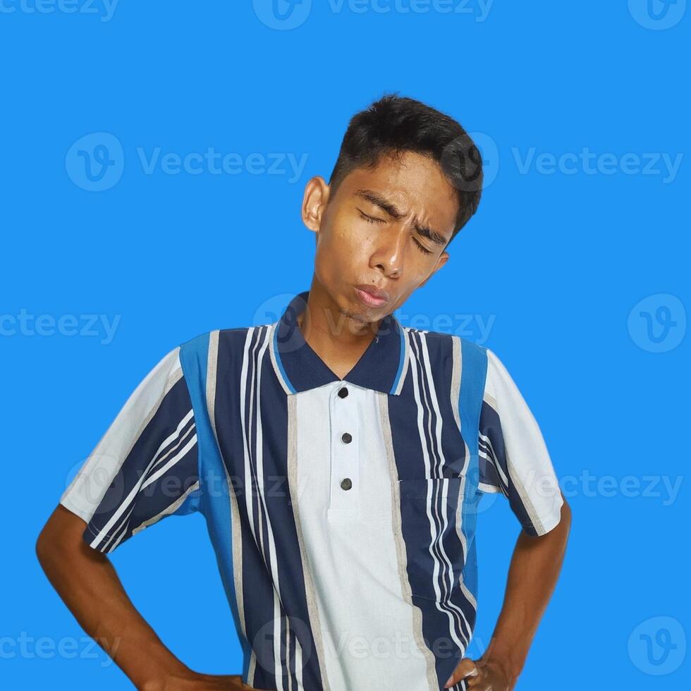 young Asian man crying, wearing t-shirt. isolated white background. photo