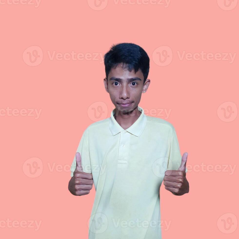 Happy smiling face of young asian man color yellow t-shirt white background photo