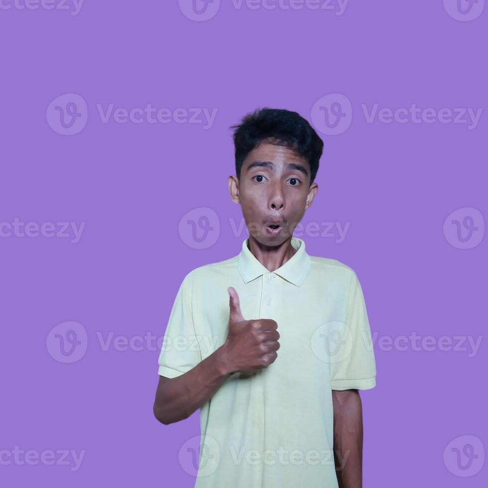 Asian man smiling face with okay gesture, isolated on purple background photo