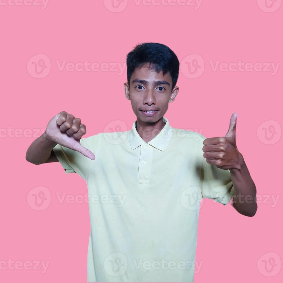 Happy smiling face of young asian man color yellow t-shirt white background photo