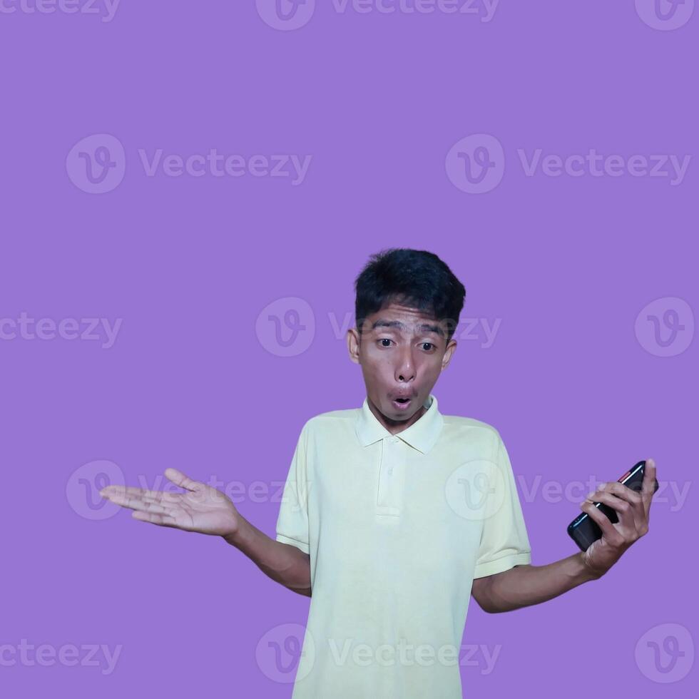 surprised face of young Asian man pointing at the empty photocopy space with a surprised face photo
