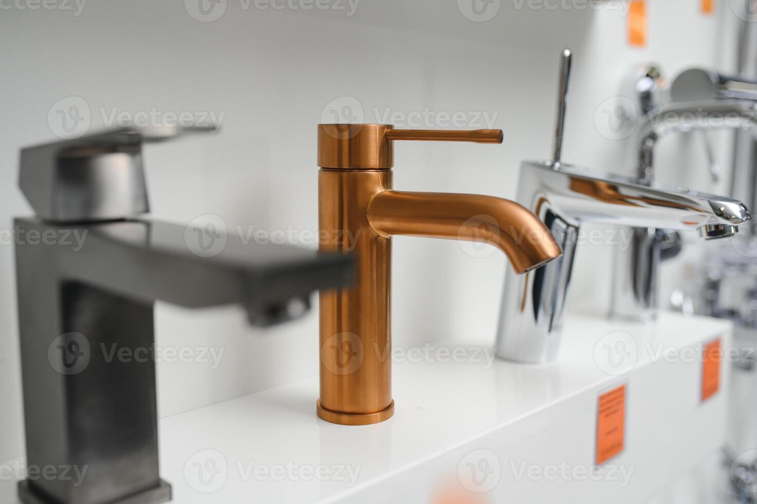 Rows of new faucets in plumbing shop photo