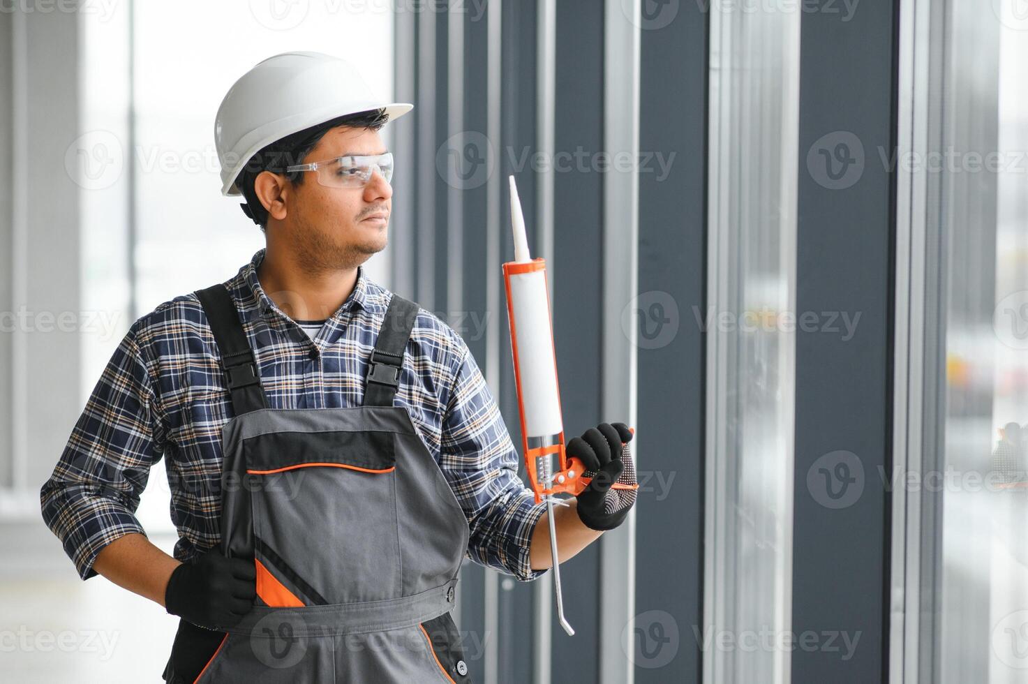 Construction worker repairing plastic windows. Banner design photo