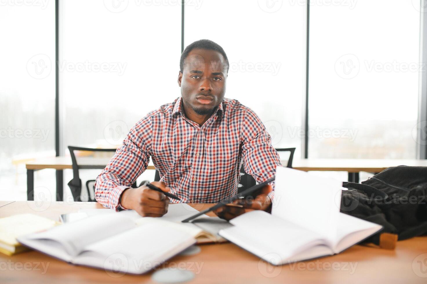 Portrait of african university student in class looking at camera photo