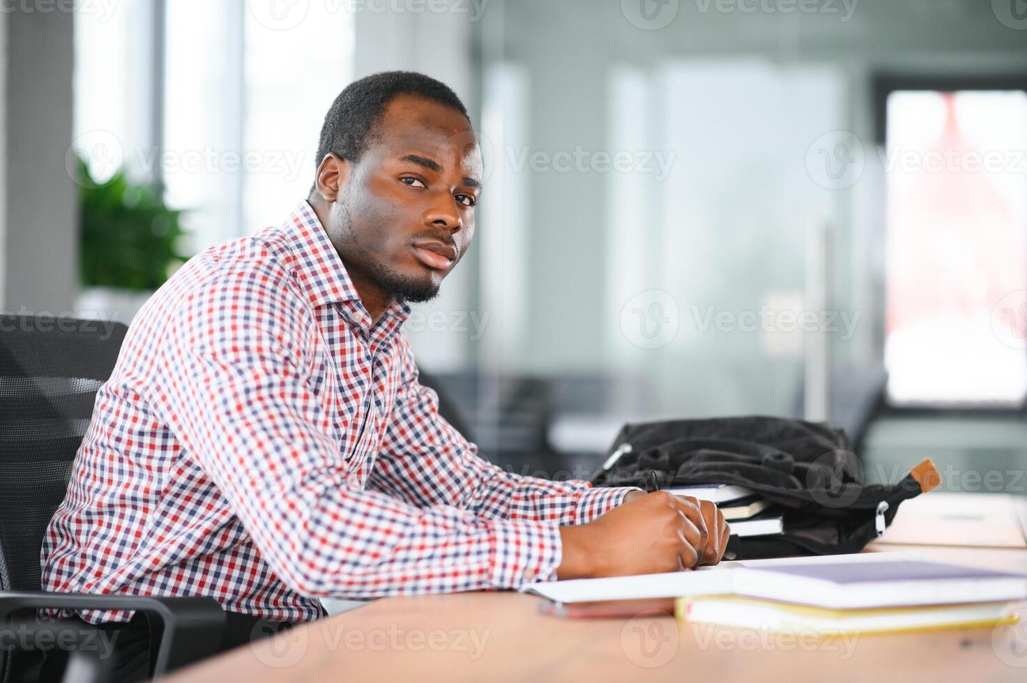 Portrait of african university student in class looking at camera photo