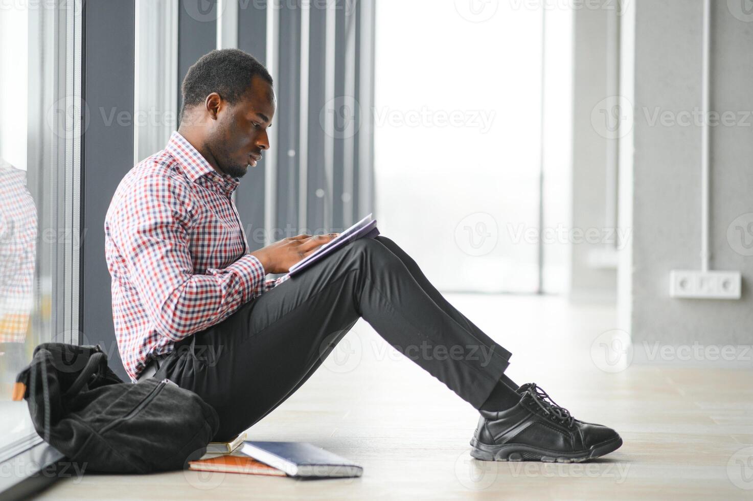 Portrait of african boy at college campus photo