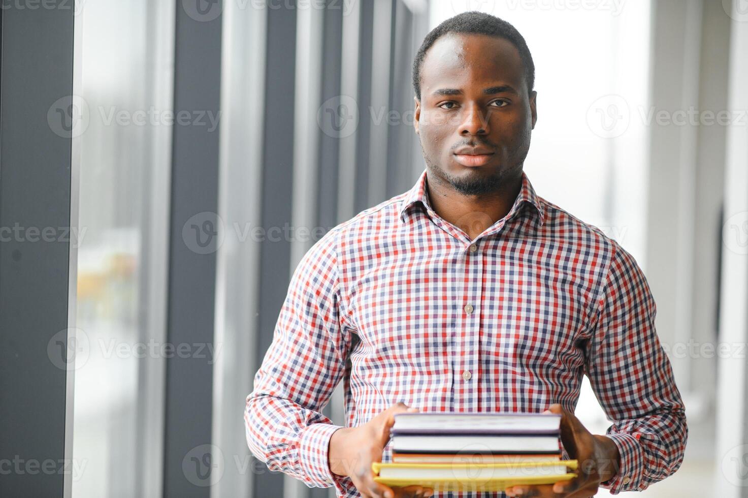 black student at university classroom and thinking of something photo