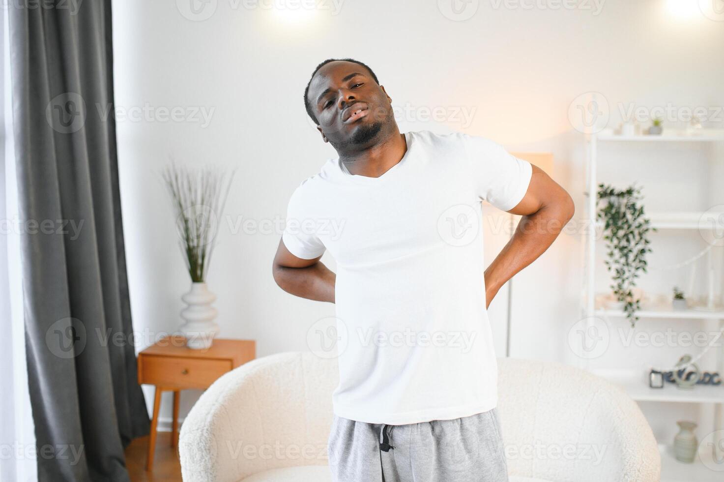Young African Man Having Back Pain photo